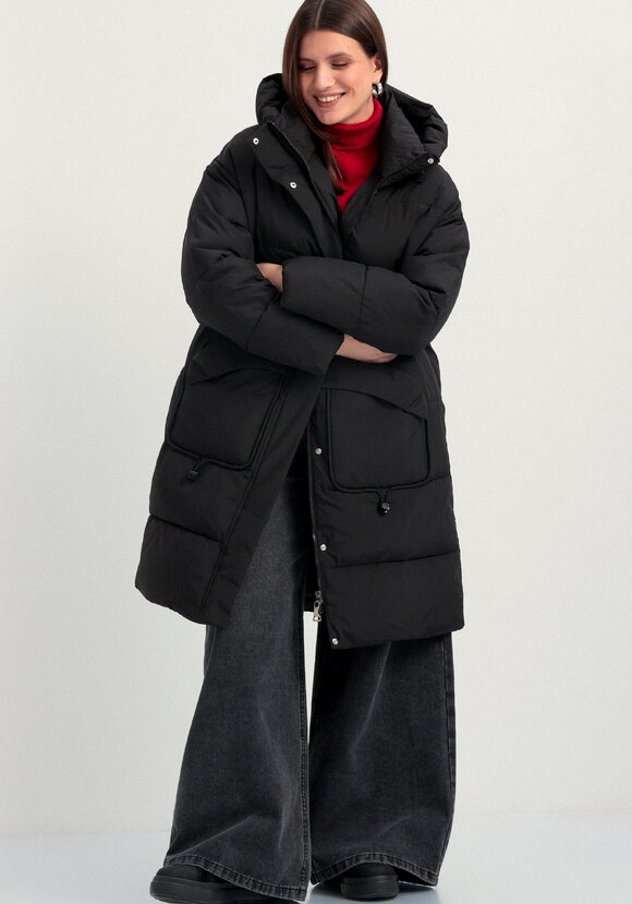 Пуховик стеганый с асимметричными карманами